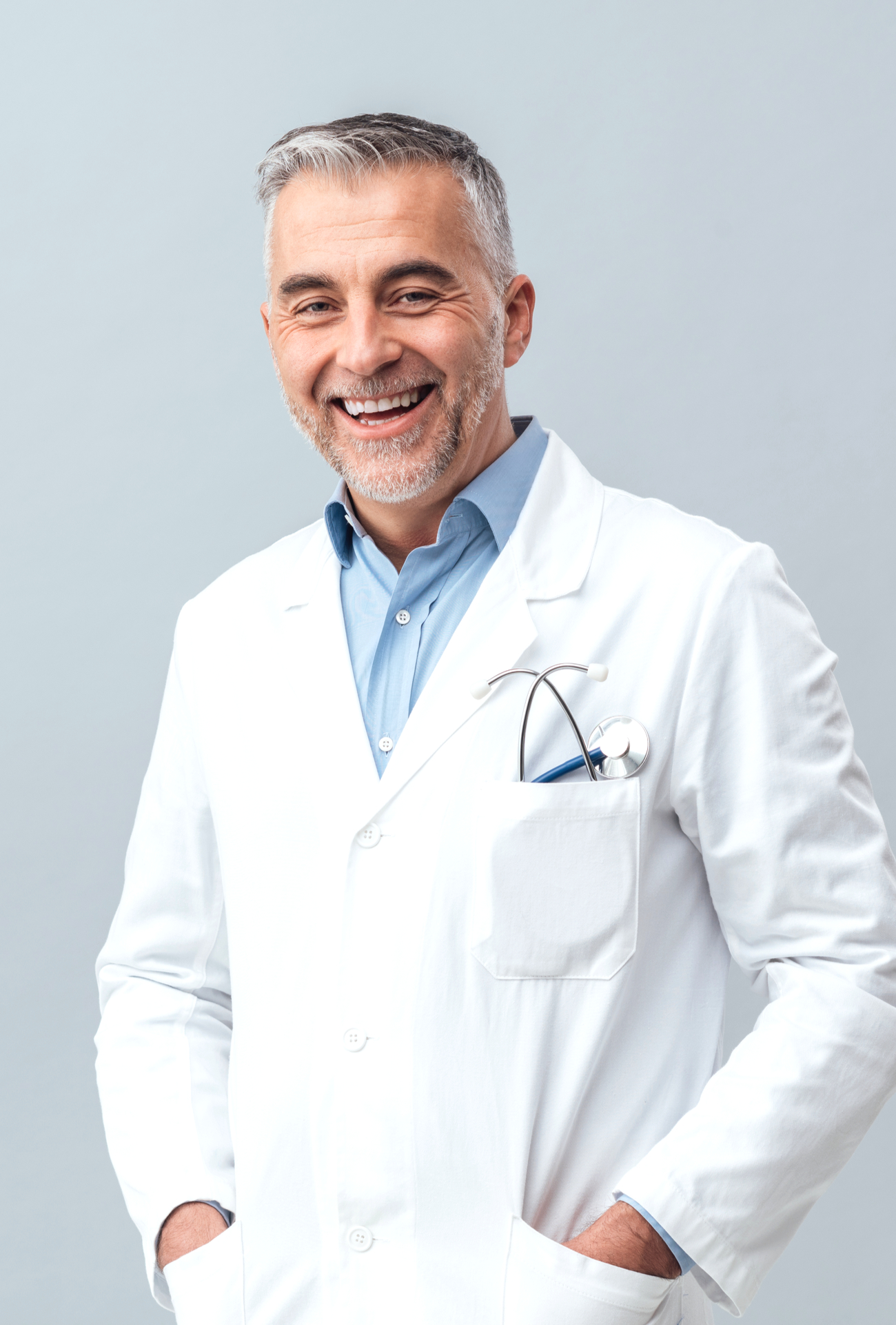 mature doctor posing and smiling at camera